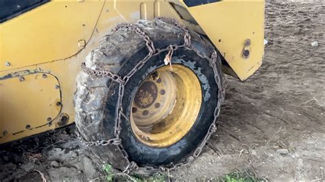 chaining down a skid steer|how to chain down skid steer.